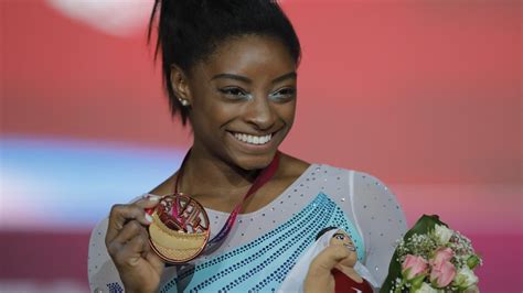 Simone Biles wins fourth world all-around title, after falls, by record ...