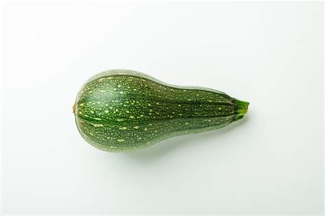 Fresh ripe green zucchini squash on white | Premium Photo