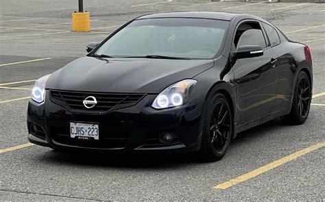 a murdered out 2012 nissan altima coupe. because the kid that got ...