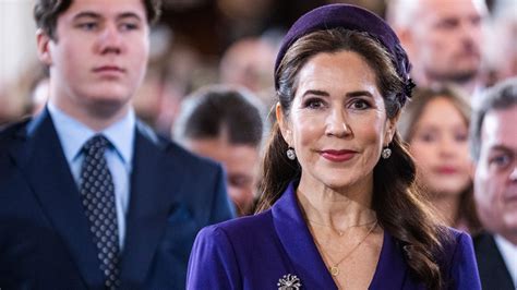 Queen Mary of Denmark is a vision in purple for church service with ...