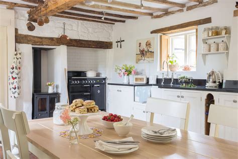 Real home: a tiny thatched cottage full of light | Small cottage ...