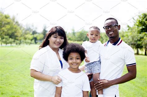 Happy diverse and mixed race family group photo in the park | High ...