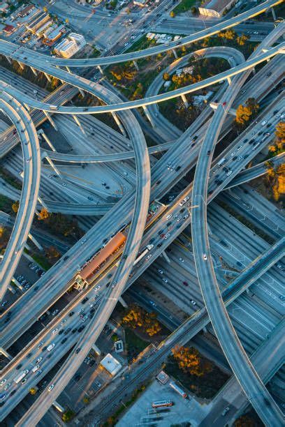 Aerial view of highway interchange in cityscape | Aerial view, Aerial, Cityscape