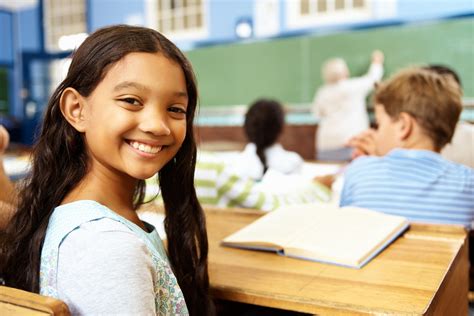 Elementary student smiling in classroom | NNPA ESSA MEDIA CAMPAIGN