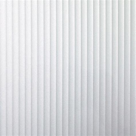 a white wall with vertical blinds on it