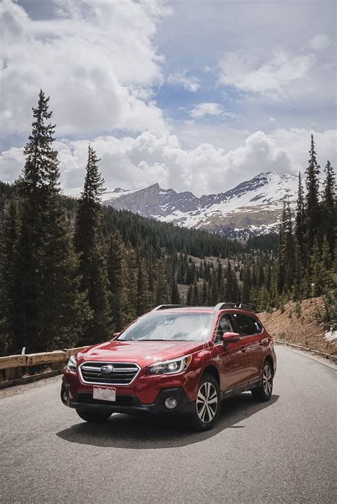 2019 Crimson Red Pearl Subaru Outback driving up scenic Guanella Pass in Colorado's Rocky ...