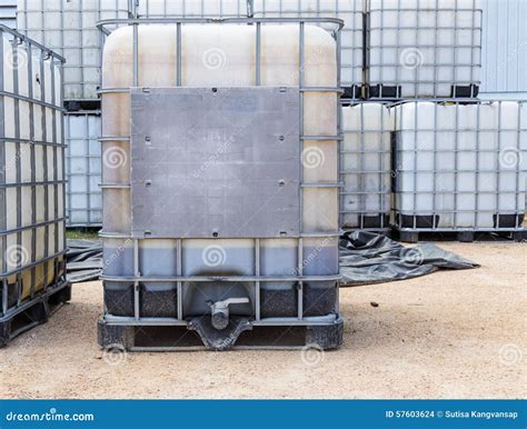 Plastic Oil or Liquid Containers with Metallic Cage Stock Photo - Image of cage, industry: 57603624