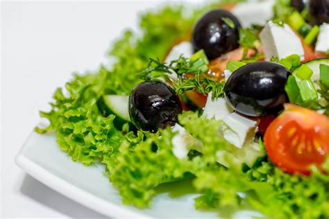 Salad with fresh avocado, cherry tomatoes, orange slices and arugula leaves (Flip 2019 ...