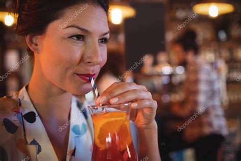 Woman having cocktail drink — Stock Photo © Wavebreakmedia #152283850