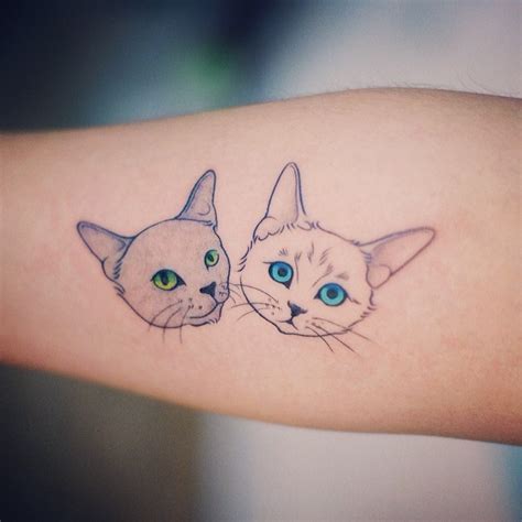 Two cats tattoo - Tattoogrid.net