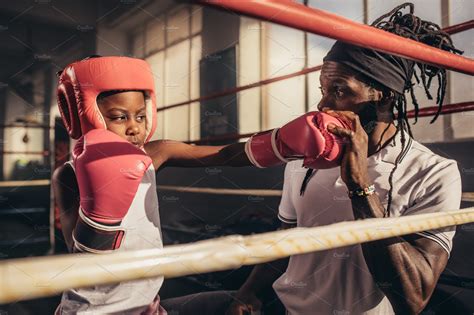 Boxing kid training with his coach | Sports & Recreation Stock Photos ...