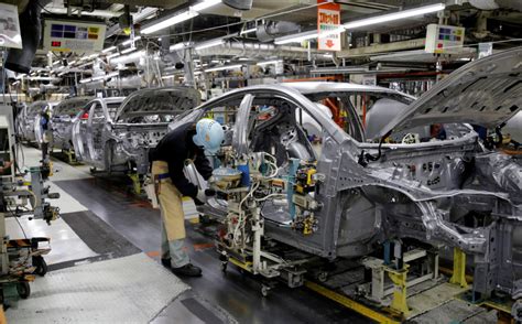 Toyota slashes production as pandemic strains supply chain | PBS News