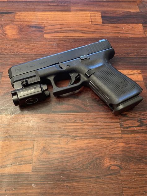 Glock 19.5 w/ Olight PL mini 2 : r/Glocks