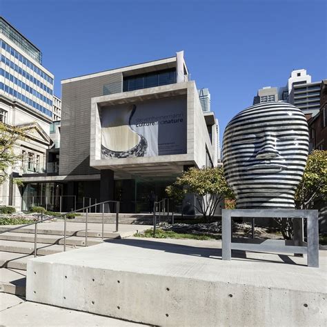 a large sculpture in front of a building with stairs leading up to it ...