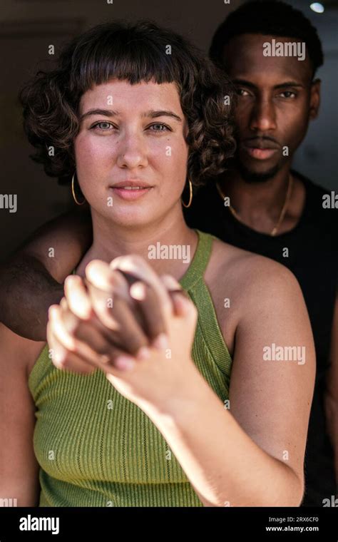 Affectionate boyfriend and girlfriend holding hands Stock Photo - Alamy