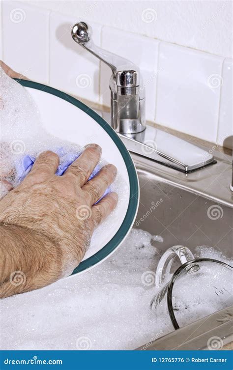 Hand washing the dishes stock photo. Image of bubbles - 12765776