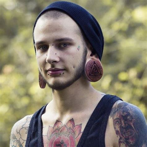 Loving his tattoos and the plugs. Actually just loving the guy over all ...