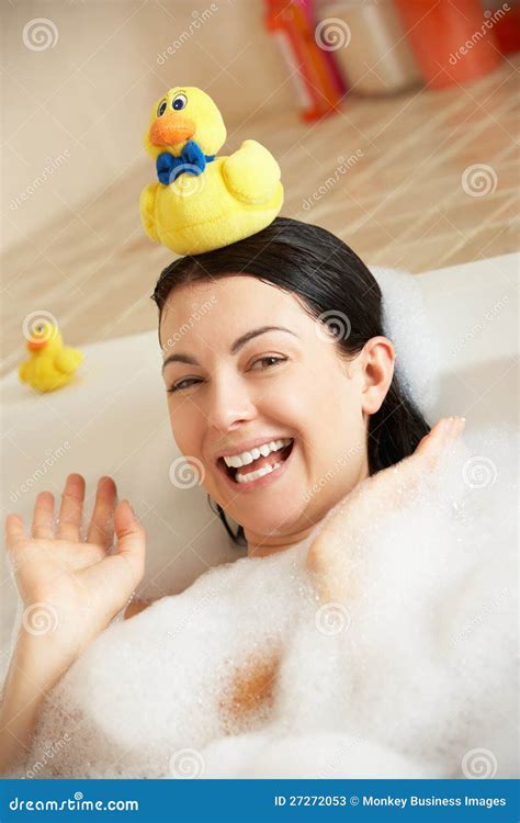 Woman Relaxing In Bubble Filled Bath Stock Photos - Image: 27272053