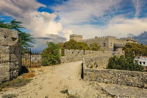 HD wallpaper: architectural photo of stone castle under blue sky with white clouds | Wallpaper Flare