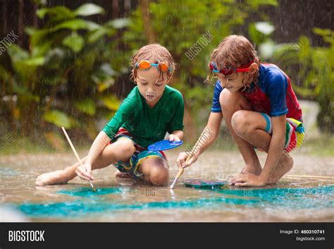 Kids Playing Rain. Image & Photo (Free Trial) | Bigstock