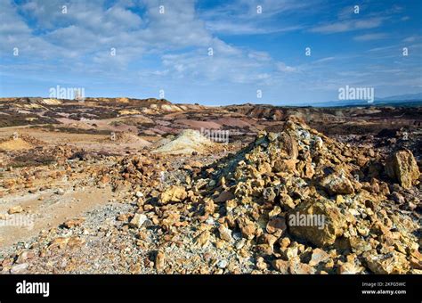 Industrial windmill on skyline of historic copper mine on Parys ...