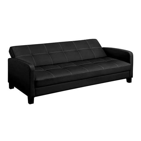 a black leather couch sitting on top of a white floor