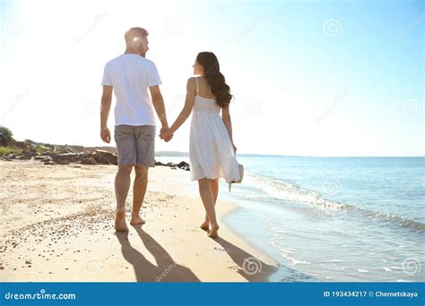 Happy Couple Walking on Beach Near Sea. Honeymoon Trip Stock Image - Image of husband, lifestyle ...