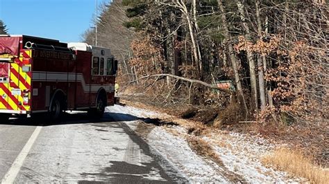 Mechanical issue plunges dump truck into tree line on Route 16 in New Hampshire