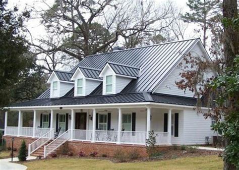 Dark tin roof on a white farm house with black shutters, big font porch ...