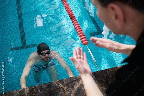 Swimming pool - swimmer training competition in class with coach Stock Photo | Adobe Stock