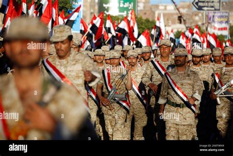 Shiite fighters, known as Houthis, wearing army uniforms march during a ...