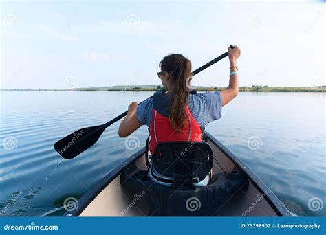 Young Woman Canoeing in the Lake on a Summer Day. Stock Photo - Image ...