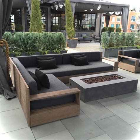 an outdoor seating area with couches and tables