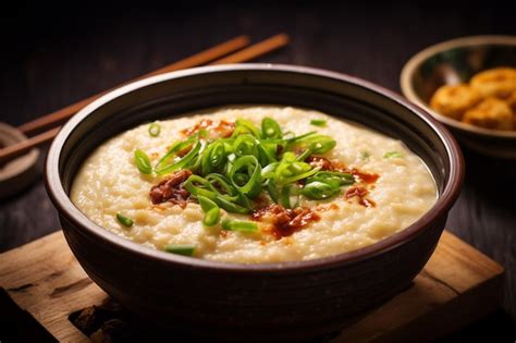 Premium Photo | Tofu jook congee with ginger and green onions