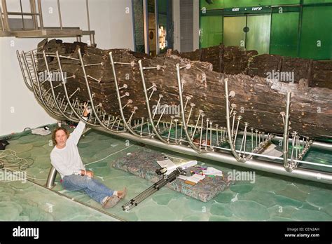 Researcher with ancient Galilee boat at the Yigal Allon Centre (Jesus Stock Photo: 43488777 - Alamy