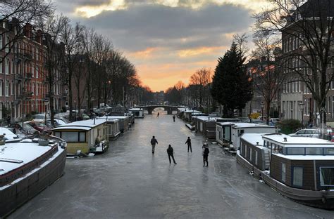 Amsterdam Canal Ice Skating Photograph by Roevin