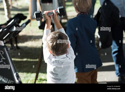 Child lifting weights hi-res stock photography and images - Alamy