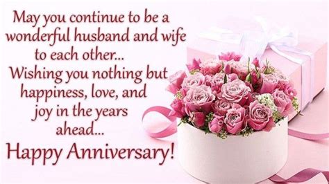 pink roses are in a white vase on a pink background with the words, happy anniversary