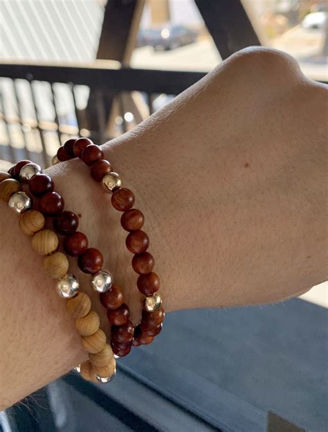 The natural grain of these wooden bead bracelets make a beautiful statement. We love these ...