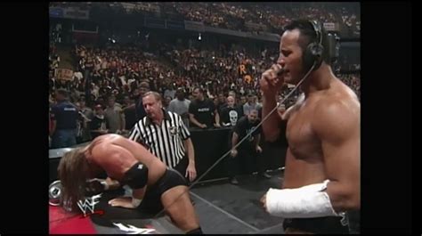 The Rock on the headset against Triple H at Over The Edge (1999) | Over the edge 1999, Wwf, Triple h