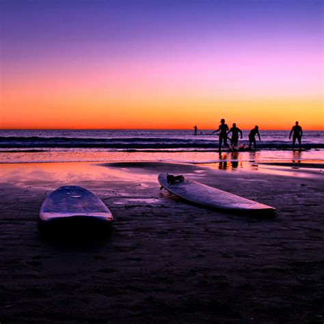 Surfers At Sunset iPad Wallpaper