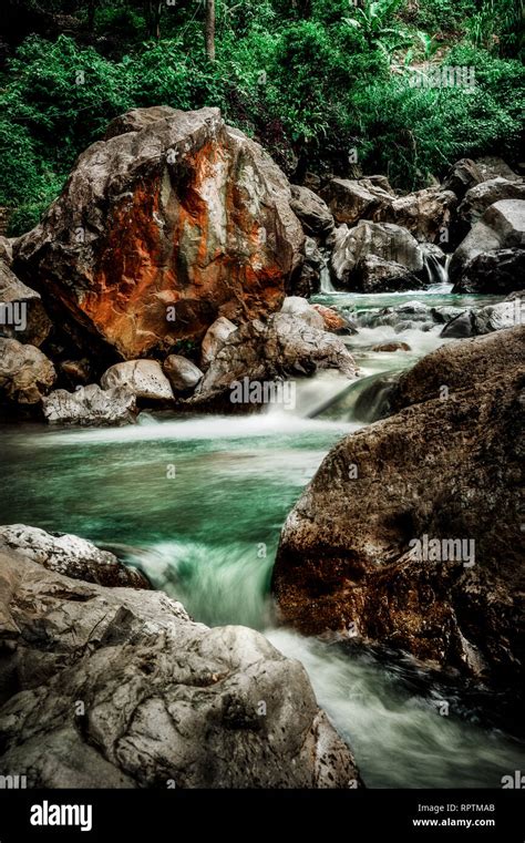 River below Leuwi Hejo Waterfall, Sentul, West Java, Indonesia Stock Photo - Alamy