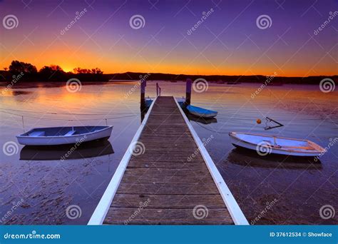 Sunset Moorings and Boat Jetty in a Little Cove Australia Stock Photo ...