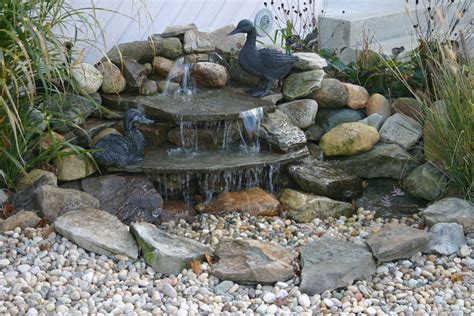 Aesthetically pleasing pondless waterfall #totalpond #pondless #waterfall #waterfeature | Garden ...