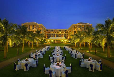 an outdoor dining area with tables and chairs set up in front of a ...