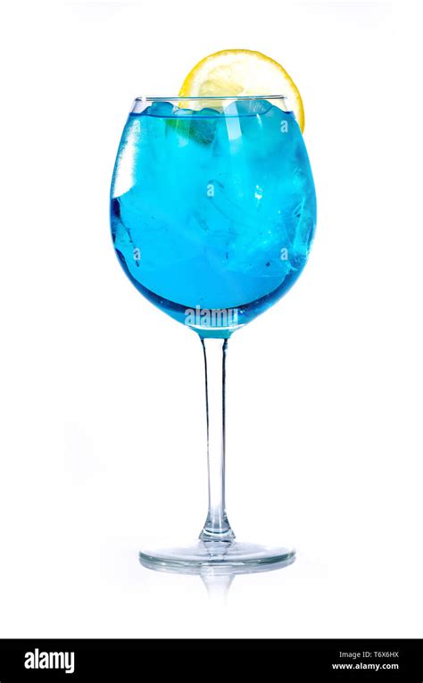 blue drink with ice cubes and lemon on white background, isolated Stock ...