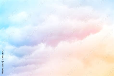 Rainbow Clouds. A soft cloud background with a pastel colored orange to blue gradient. Stock ...