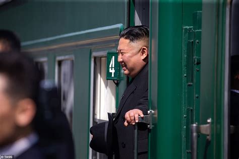 Kim Jong-un returns to North Korea on his train - as he steps out of ...