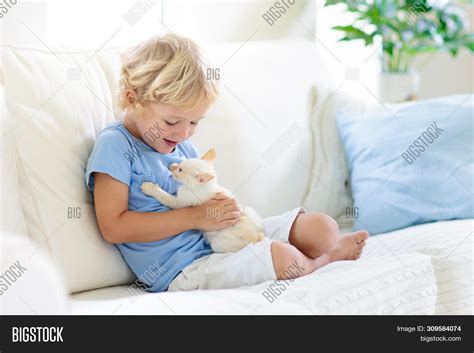 Child Playing Baby Cat Image & Photo (Free Trial) | Bigstock