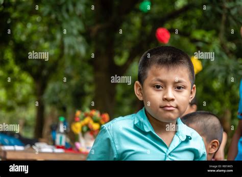 latin kids sitting at picnic table at party in Guatemala Stock Photo - Alamy